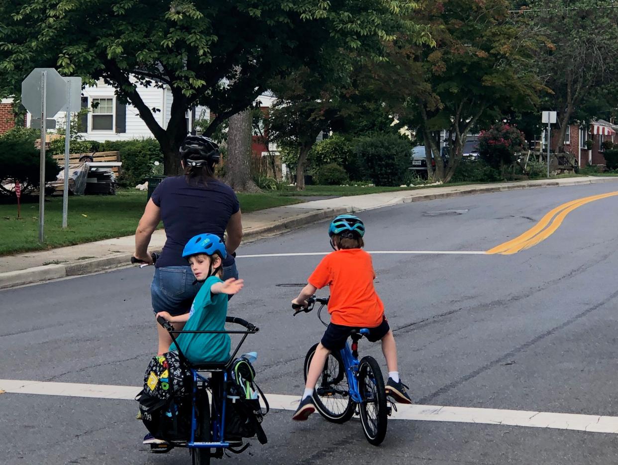 Shannon Brescher Shea biking with her kids