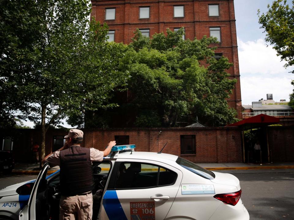 A police officer stands in front of the Faena Art Hotel in Buenos Aires, hours after Saturday's attack: AP