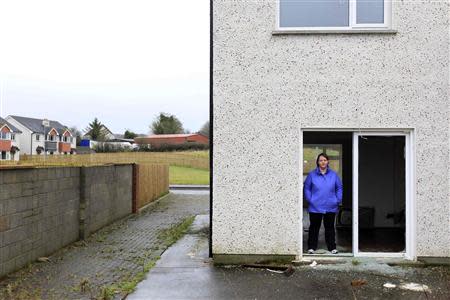 Rhoda Brogan poses for a photograph in the show home which neighbours her own home, on the Glenall housing estate in the village of Borris-in-Ossory, County Laois, Ireland February 13, 2013. REUTERS/Cathal McNaughton