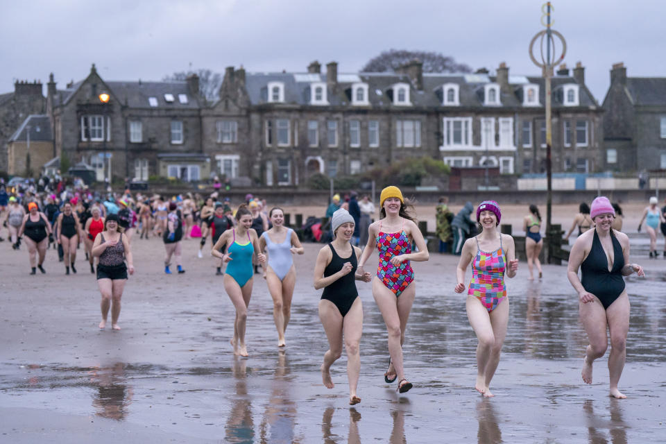 Swimmers take a dip in the Firth of Forth at Portobello in Edinburgh, to mark International Women's Day, on Friday March 8, 2024. (Jane Barlow/PA via AP)