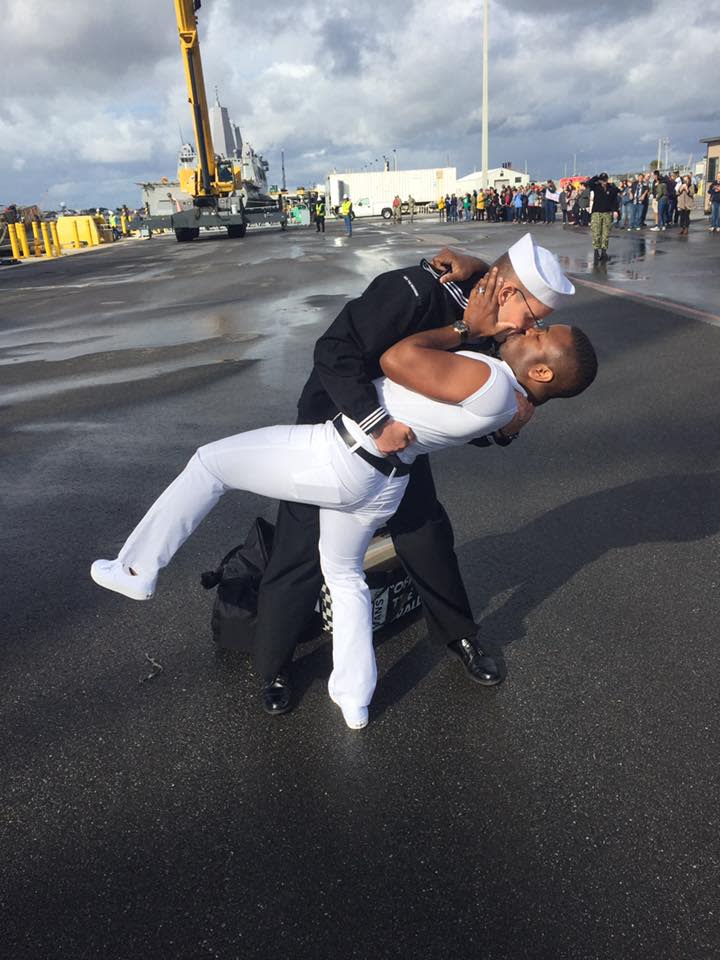 Kenneth and Bryan Woodington shared their first kiss in seven months since Bryan’s deployment, re-creating an iconic kiss in Times Square, N.Y. (Photo: Facebook/Naval Station Mayport)