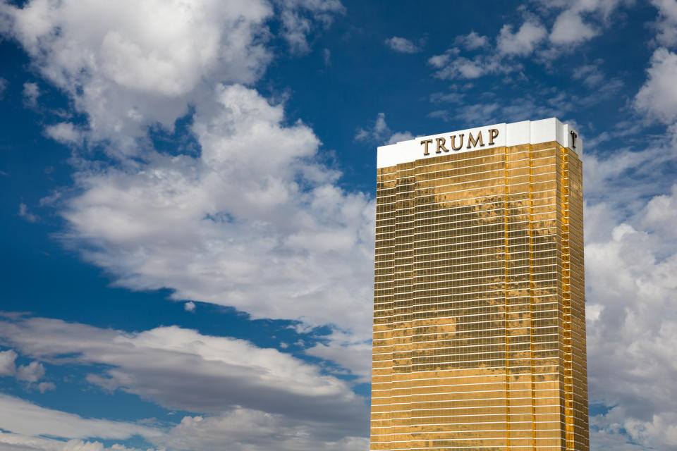 Las Vegas, USA - October 28, 2016:  Trump International Hotel in Las Vegas, NV set against a dramatic blue sky.  Named for US real estate developer and politician Donald Trump, the 64-story luxury property's exterior windows are gilded with 24-carat gold.