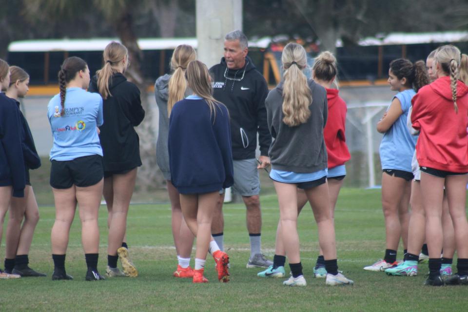 St. Johns Country Day head coach Mike Pickett issues tactical instructions to his team during Friday's practice.