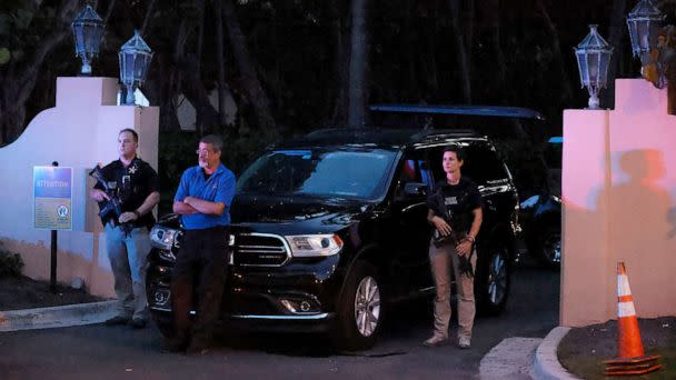 PHOTO: Armed Secret Service agents stand outside an entrance to former President Donald Trump's Mar-a-Lago estate, late Monday, Aug. 8, 2022, in Palm Beach, Fla. (Terry Renna/AP)