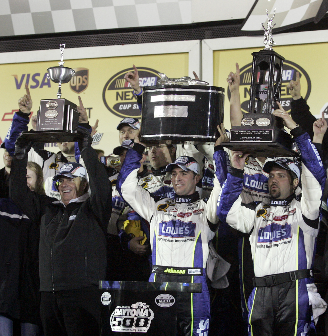 Jimmie Johnson celebrates his 2006 Daytona 500 win with team owner Rick Hendrick and crew chief Darian Grubb.