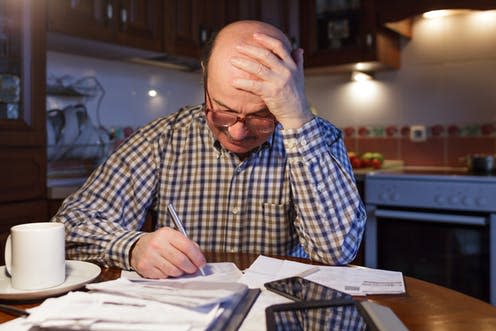 <span class="caption">Many people on low incomes are paying dearly for access to credit.</span> <span class="attribution"><a class="link " href="https://www.shutterstock.com/image-photo/elderly-man-calculates-family-budget-night-599762690?src=HhI9aY-IaueyC-_rs6wIvg-1-33" rel="nofollow noopener" target="_blank" data-ylk="slk:shutterstock.com;elm:context_link;itc:0;sec:content-canvas">shutterstock.com</a></span>