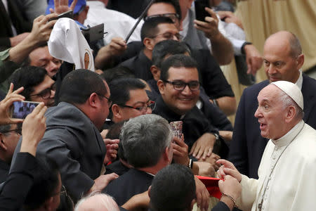 Pope Francis greets the faithful as he attends a special audience for pilgrims from El Salvador at Paul VI Hall at the Vatican, October 15, 2018. REUTERS/Tony Gentile