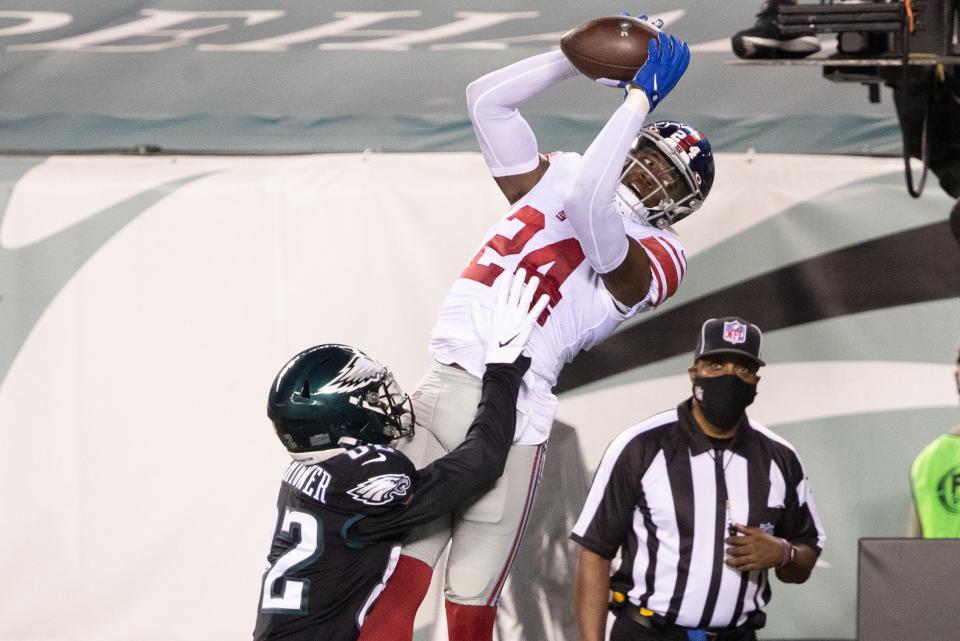 New York Giants cornerback James Bradberry (24) intercepts the ball in front of Philadelphia Eagles wide receiver John Hightower in the end zone.