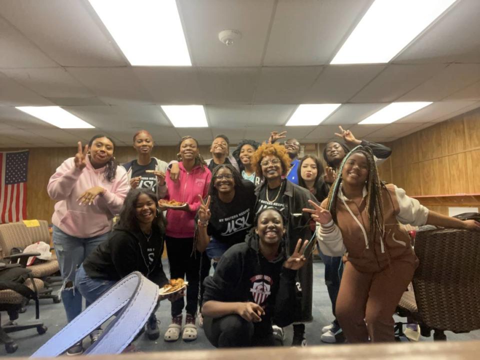 Southwest High School students who are in the My Sister’s Keeper program enjoy pizza at one of their weekly meetings. Courtesy/Southwest High School My Sister's Keeper