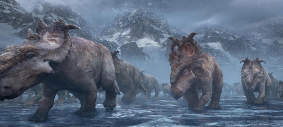 In this image released by 20th Century Fox, Patchi, center, walks with the herd in a scene from the film, "Walking With Dinosaurs." (AP Photo/20th Century Fox)