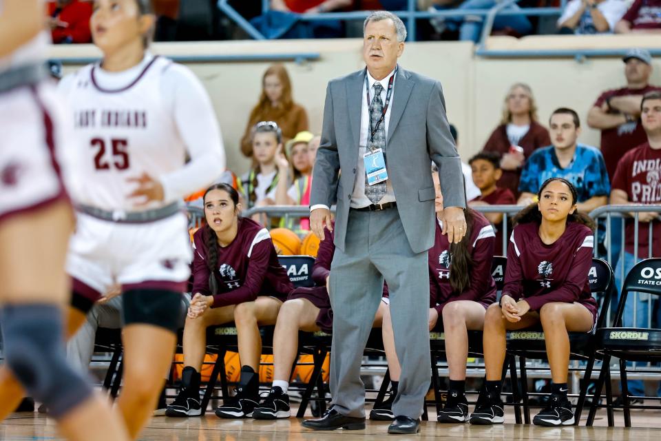 Pocola head coach Mark McKenzie yells to his players during a Class 2A girls basketball state quarterfinal game against Merritt on Wednesday at State Fair Arena.