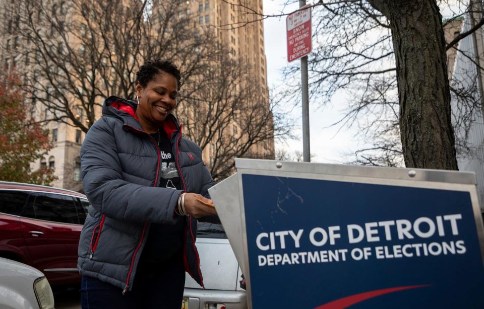 Sheryl Evans of Detroit drops her ballot early morning in a ballot drop box in front of the Detroit Department of Elections in Detroit on Tuesday, Nov. 8, 2022. 