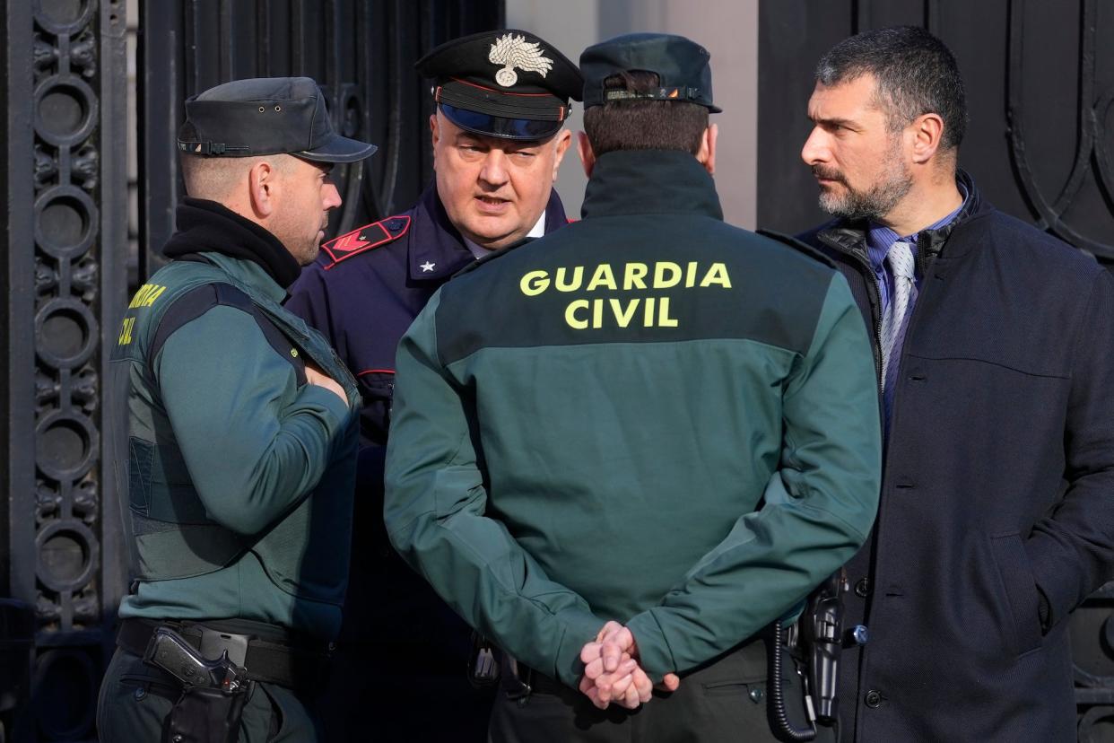 Spanish Civil Guards and Italian embassy employee at Madrid's Italian embassy