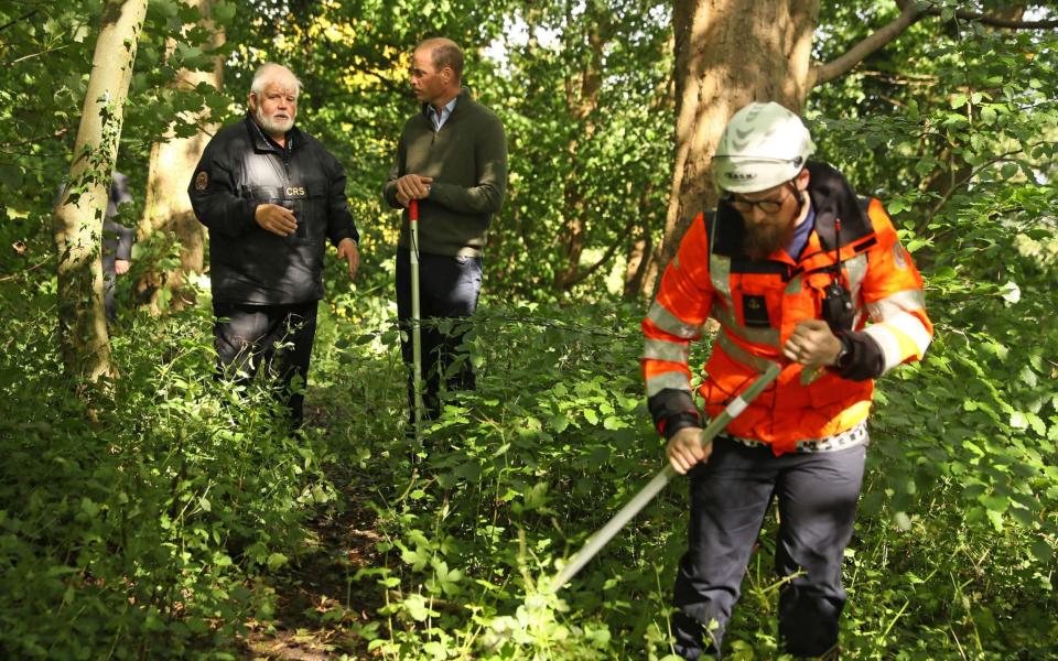 The Duke of Cambridge (right)speaks with Community Rescue Service (CRS) founder and regional commander Sean McCarry during a visit to the CRS at Cave Hill Country Park - Brian Lawless