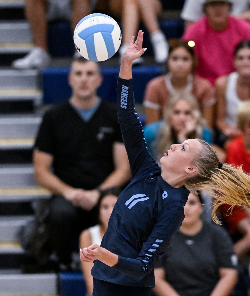 Redwood's Kennedy Cutler hits against Frontier in a non-league high school volleyball match Tuesday, August 22, 2023.