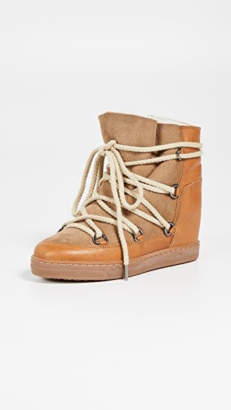 <p><strong>Isabel Marant</strong></p><p>shopbop.com</p><p><strong>$680.00</strong></p><p><a href="https://go.redirectingat.com?id=74968X1596630&url=https%3A%2F%2Fwww.shopbop.com%2Fnowles-boots-isabel-marant%2Fvp%2Fv%3D1%2F1503602062.htm&sref=https%3A%2F%2Fwww.harpersbazaar.com%2Ffashion%2Ftrends%2Fg3124%2Fbest-snow-boots%2F" rel="nofollow noopener" target="_blank" data-ylk="slk:Shop Now;elm:context_link;itc:0;sec:content-canvas" class="link ">Shop Now</a></p><p>If cozy and functional got together to make a baby, this is it. The Isabel Marant Nowles boots just makes walking around during winter look (and feel) so good!</p>