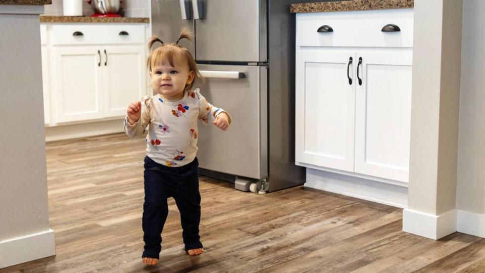 Aubrey and Ryan Nobili’s daughter Vivi, 1, walks in the kitchen of their Nampa home in March.