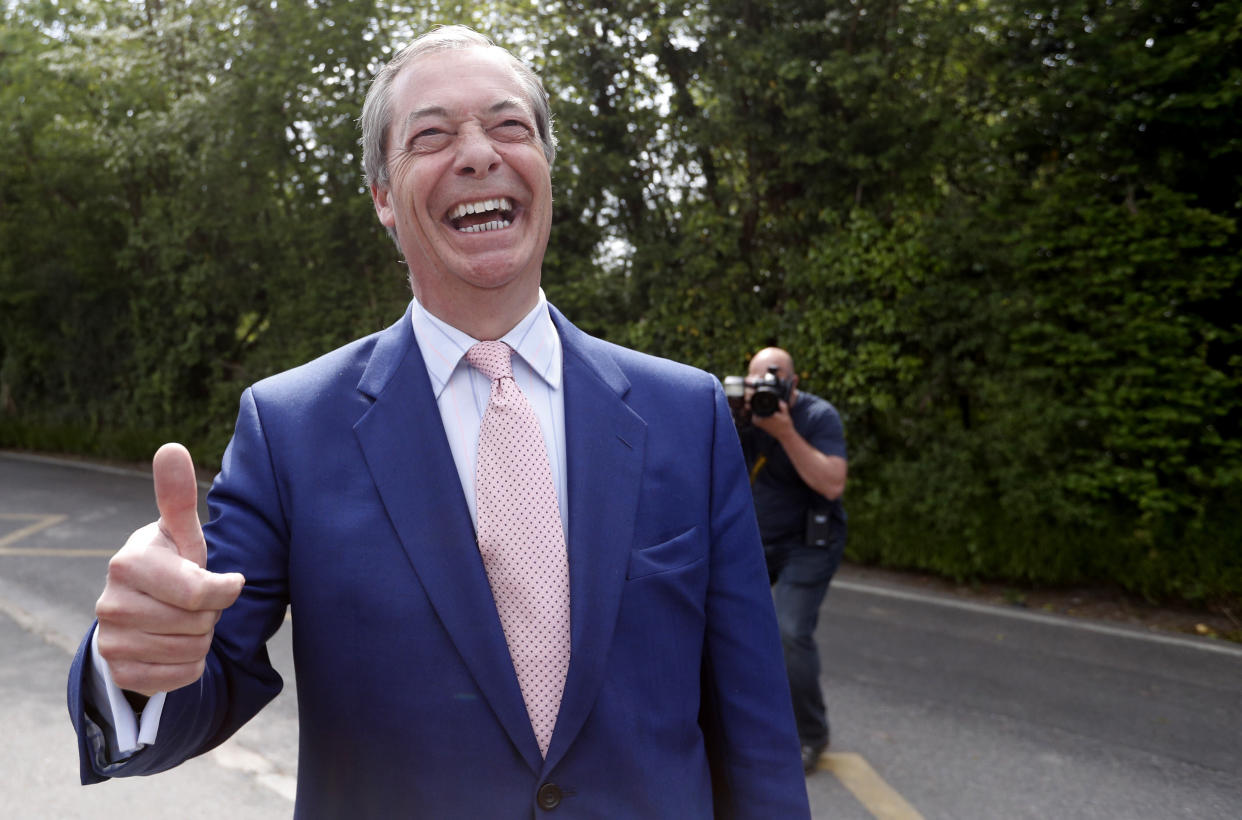 Brexit Party leader Nigel Farage gives the thumbs up to the media outside the polling station at Cudham Primary School in Biggin Hill, England, Thursday, May 23, 2019. Some 400 million Europeans from 28 countries head to the polls from Thursday to Sunday to choose their representatives at the European Parliament for the next five years. (AP Photo/Alastair Grant)