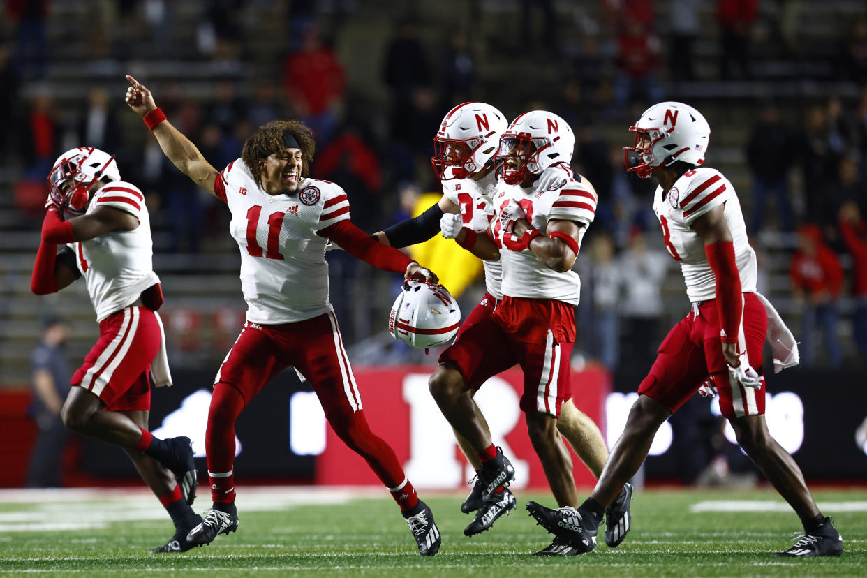Nebraska's Malcolm Hartzog (13) celebrates his interception with teammates against Rutgers on October 7, 2022 in Piscataway, New Jersey. Nebraska defeated Rutgers 14-13. (Photo by Rich Schultz/Getty Images)