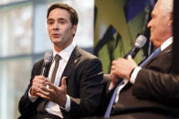 Jimmie Johnson answers a reporter's question during his retirement announcement from NASCAR at a news conference near Charlotte, N.C., Thursday, Nov. 21, 2019. (AP Photo/Bob Leverone)