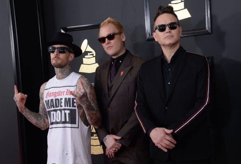 Left to right, recording artists Mark Hoppus, Travis Barker and Matt Skiba, of Blink-182 arrive for the 59th annual Grammy Awards held at Staples Center in Los Angeles in 2017. File Photo by Jim Ruymen/UPI