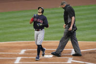 Cleveland Indians' Cesar Hernandez (7) scores after hitting a home run during the first inning of a baseball game against the Los Angeles Angels Monday, May 17, 2021, in Los Angeles. (AP Photo/Ashley Landis)