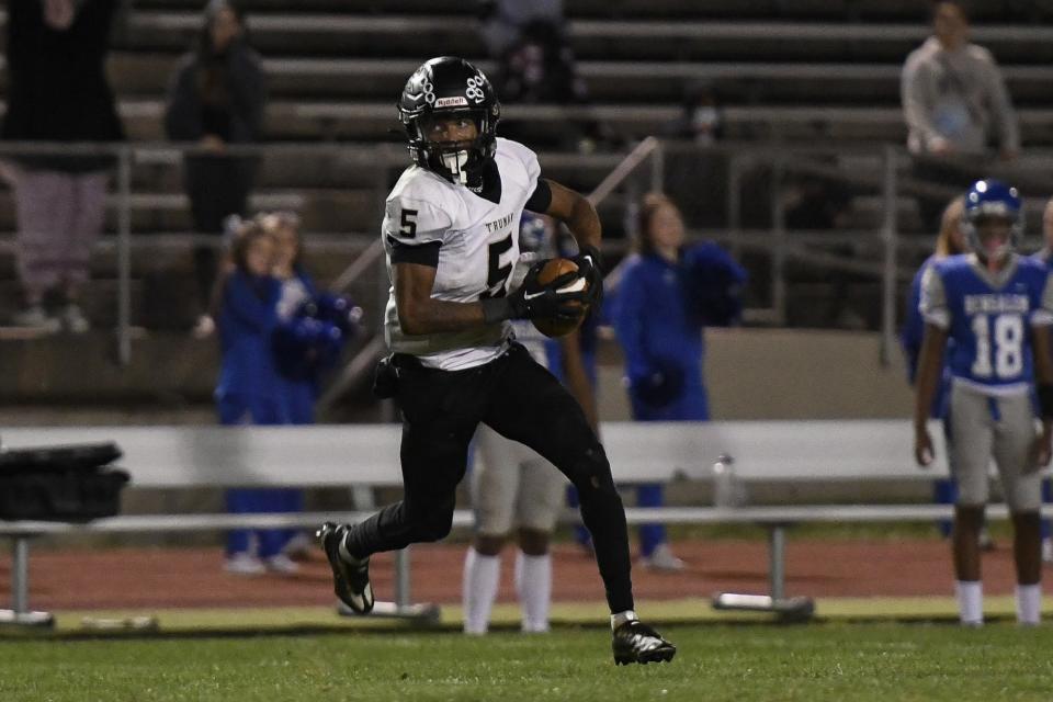 Truman's Rondell Bradley carries the ball on Friday, September 30, 2022. Truman defeated Bensalem 8-7. [LIZ DIRETTO / PHOTOJOURNALIST]