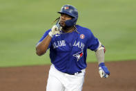 Toronto Blue Jays' Vladimir Guerrero Jr. celebrates as he rounds third base after hitting a solo home run against the Philadelphia Phillies during the first inning of a baseball game Saturday, May 15, 2021, in Dunedin, Fla. (AP Photo/Mike Carlson)