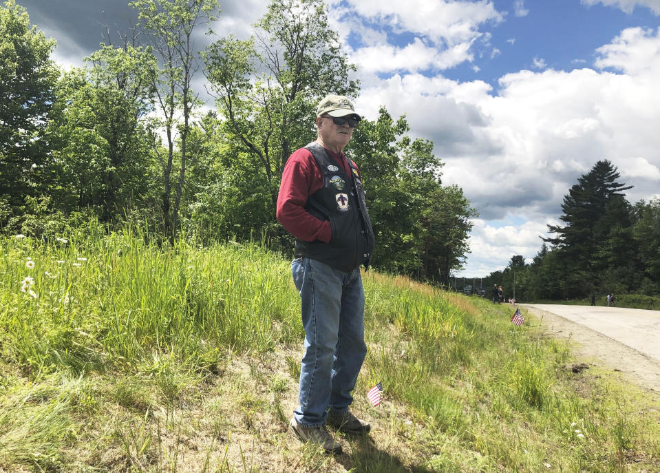 Bill Brown, a 73-year-old Vietnam vet from Bethlehem, N.H., visits an area in Randolph, N.H., Saturday, June 22, 2019, where motorcyclists with a club comprised of ex-United States Marines collided with a pickup truck on a rural highway late Friday. Investigators pleaded Saturday for members of the public to come forward with information that could help them determine why the pickup truck hauling a trailer collided with a group of motorcycles on a rural highway, killing several bikers. (AP Photo/Michael Casey)