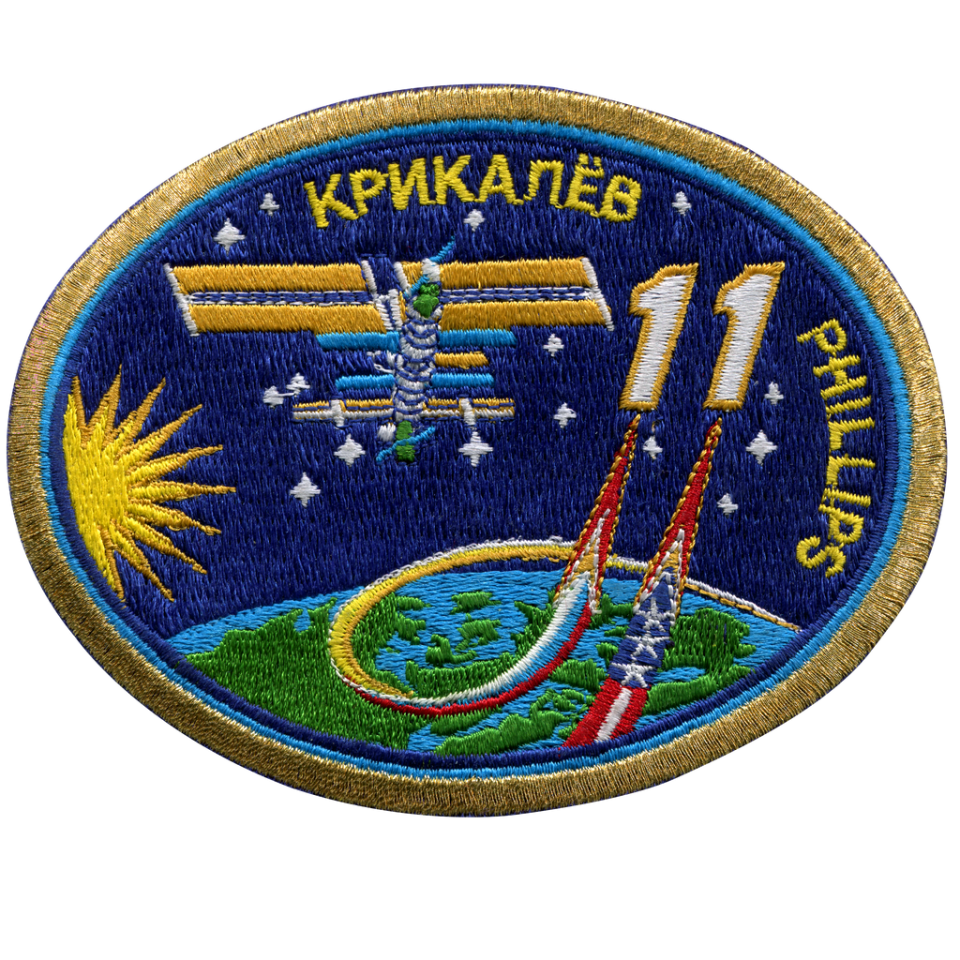 A patch showing the international space station on Earth next to the number 11