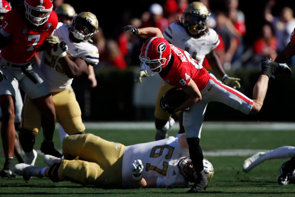 Georgia wide receiver Ladd McConkey (84) returns the ball during the first half of a NCAA college football game between Georgia Tech and Georgia in Athens, Ga., on Saturday, Nov. 26, 2022.