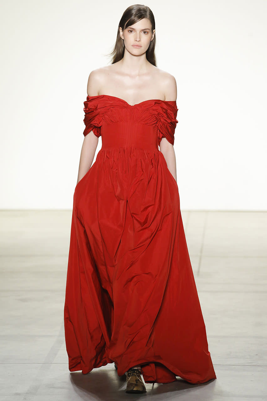 <p>A striking red off the shoulder dress at Brock Collection. (Photo: Getty Images) </p>