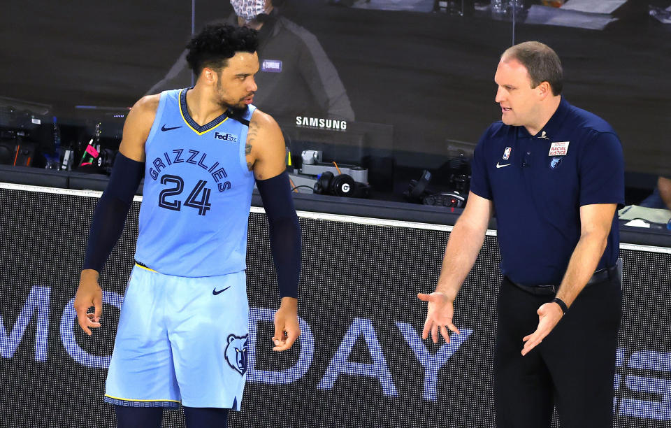 Memphis Grizzlies' Taylor Jenkins talks with Dillon Brooks during the first half of an NBA basketball game Saturday, Aug. 15, 2020, in Lake Buena Vista, Fla. (Kevin C. Cox/Pool Photo via AP)