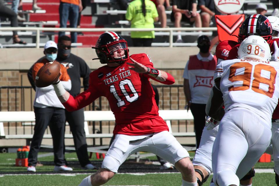 Sep 26, 2020; Lubbock, Texas, USA;  Texas Tech Red Raiders quarterback Alan Bowman (10) passes against the Texas Longhorns in the first half at Jones AT&T Stadium.