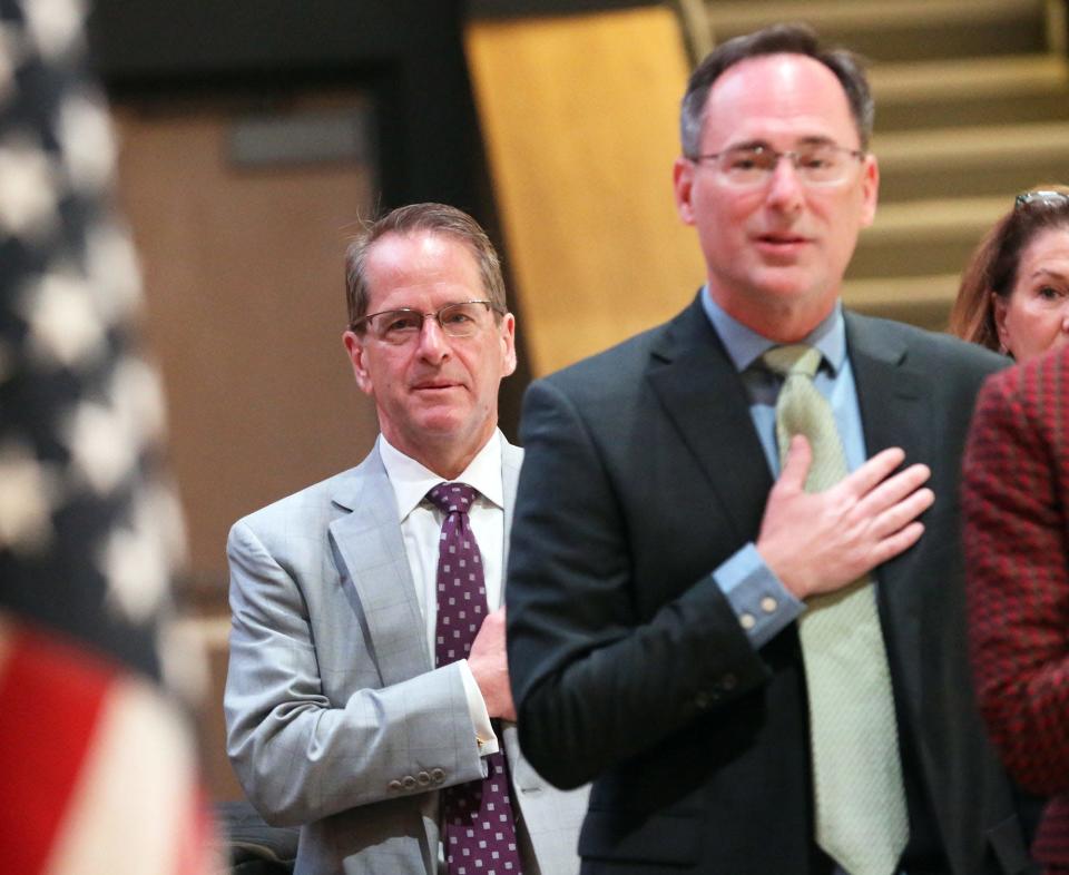 New Hampshire Education Commissioner Frank Edelblut, left, and state Board of Education Chairman 
Drew Cline say the Pledge of Allegiance before a meeting at Oyster River Middle School Thursday, May 12, 2022.