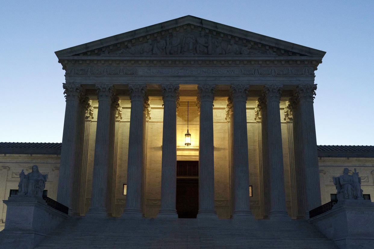 The U.S. Supreme Court is seen before sunrise on Capitol Hill in Washington.
