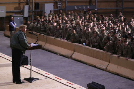 U.S. President Donald Trump delivers remarks to U.S. troops in an unannounced visit to Al Asad Air Base, Iraq December 26, 2018. REUTERS/Jonathan Ernst