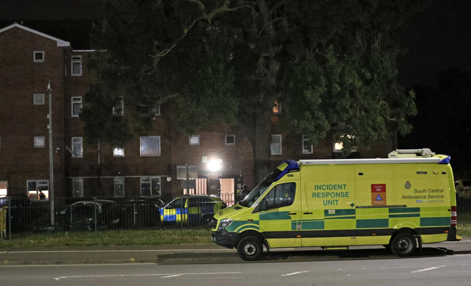 Emergency services is seen near a block of flats off Basingstoke Road in Reading after an incident at Forbury Gardens park in the town centre of Reading, England, Saturday, June 20, 2020. Several people were injured in a stabbing attack in the park on Saturday, and British media said police were treating it as “terrorism-related.” (Steve Parsons/PA via AP)