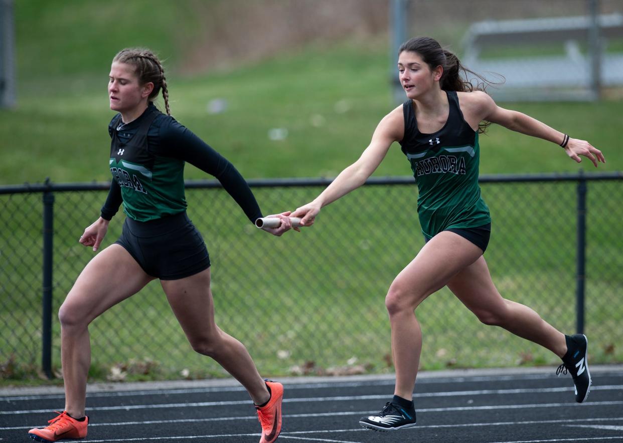 Lauren Tincher and Alyssa Marotta of Aurora track & field.