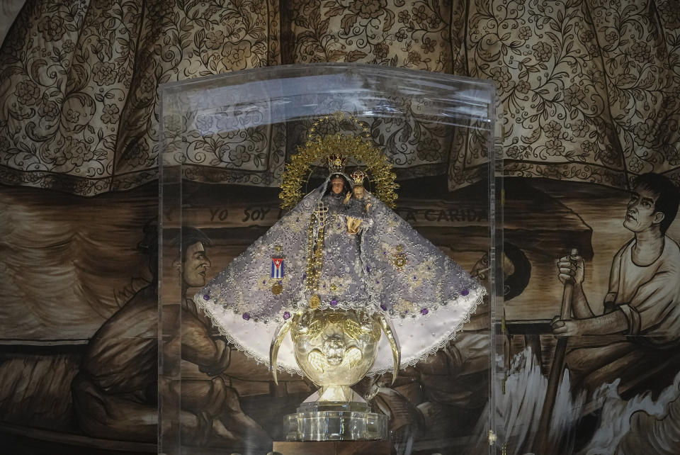 The replica of The Virgin of Charity is enclosed at the center of Our Lady of Charity shrine, in Miami, Wednesday, Feb. 14, 2024. The small statue dressed elaborately in gold was smuggled in 1961 from Havana to Miami. (AP Photo/Marta Lavandier)