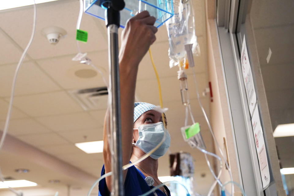 Nursing coordinator Beth Springer adjusts medicines for COVID-19 patients on a COVID ward at the Willis-Knighton Medical Center in Shreveport, La., Tuesday, Aug. 17, 2021. “I see a lot of sadness. I see a lot that I never thought I’d see in my career,” said Springer, who has been a nurse nearly 20 years. (AP Photo/Gerald Herbert)