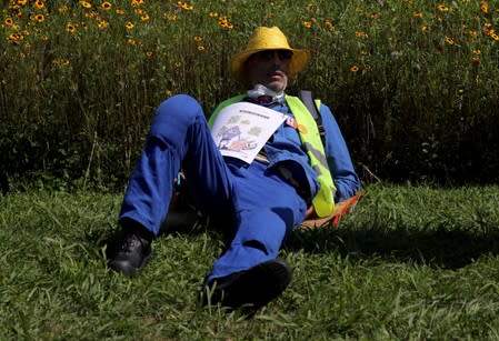 A demonstrator rests after taking part in a protest march during the G7 summit, in Irun