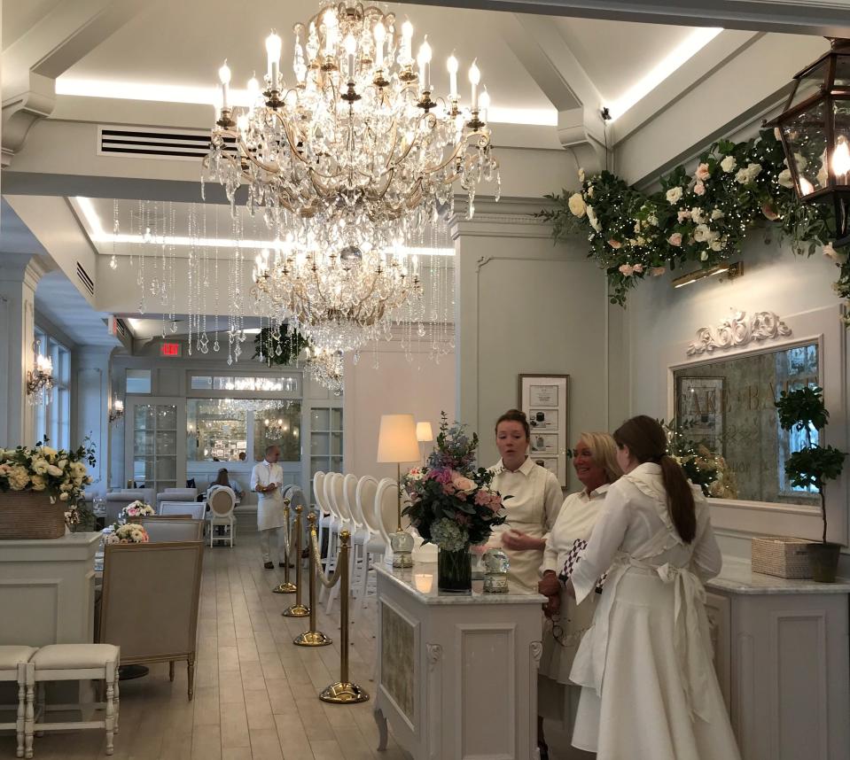 Staff await the first customers at Cake Bake Shop, which opened July 1, 2019, at Carmel City Center, 800 S. Rangeline Road.