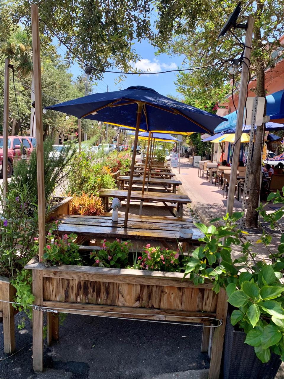 Pub Americana in Cocoa Village added extra outdoor seating during the pandemic. Now now it has become a leafy little patio where diners can munch salads, pasta dishes, pizzas and “shareables."