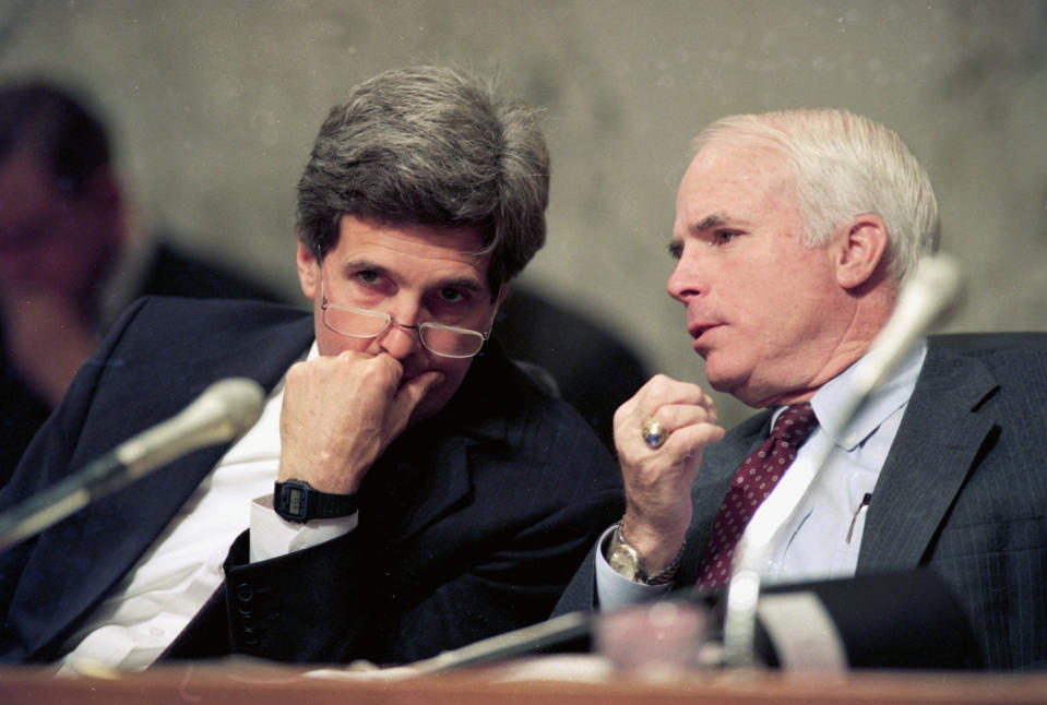 FILE - In this Dec. 1, 1992, file photo, Sen. John Kerry, D-Mass., left, chairman of the Senate Select Committee on POW/MIA Affairs, listens to Sen. John McCain, R-Ariz., a former POW in Vietnam, during a hearing of the committee on Capitol Hill in Washington. Arizona Sen. McCain, the war hero who became the GOP's standard-bearer in the 2008 election, has died. He was 81. His office says McCain died Saturday, Aug. 25, 2018. He had battled brain cancer. (AP Photo/Ron Edmonds, File)