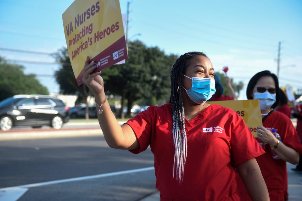 Tonya McMillon holds a sign during a protest hosted by National Nurses United (NNU) outside of Charlie Norwood VA Medical Center. Nurses at the Charlie Norwood VA Medical Center frequently work double shifts or overtime due to a large loss in staff, said Irma Westmoreland, Vice President of NNU.