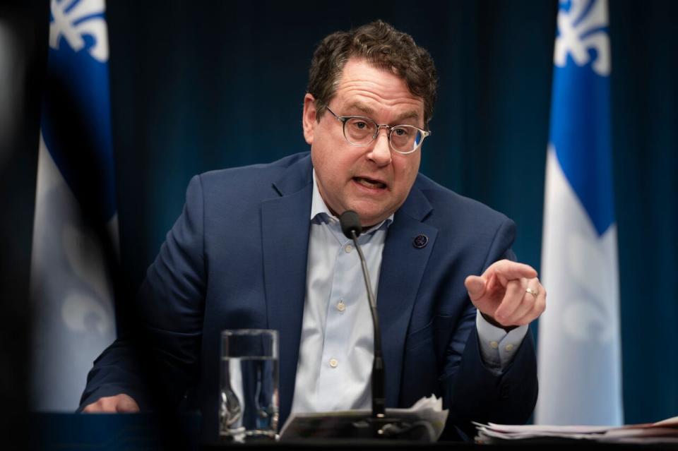 Bernard Drainville, Quebec Minister of Education. speaks to the press alongside Quebec Premiere Francois Legault during a press conference in Montreal, Sunday, Feb. 18, 2024. THE CANADIAN PRESS/Peter McCabe