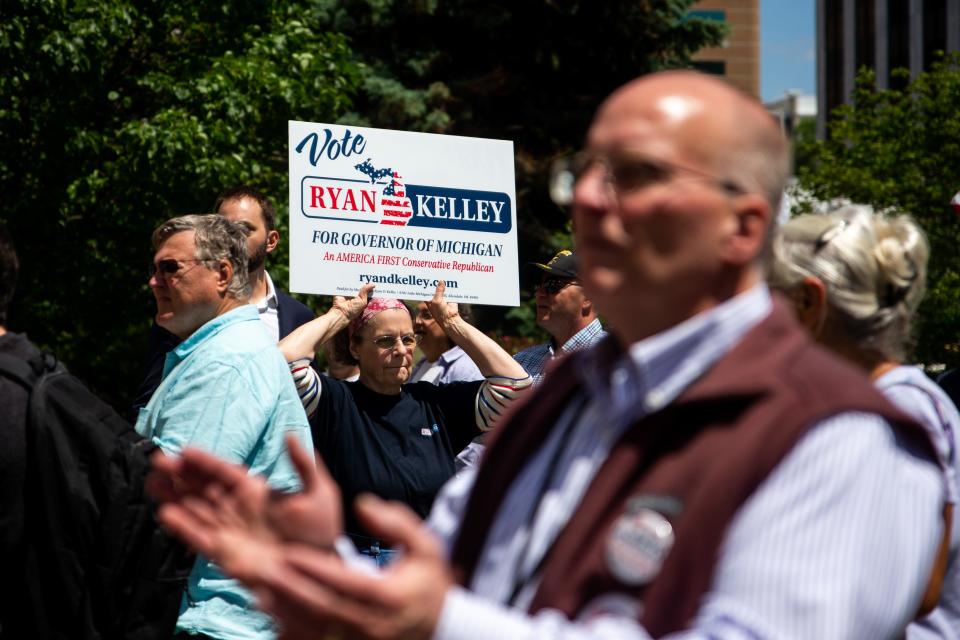 Supporters of Ryan Kelley, a Republican candidate for governor, gather outside the courthouse where Kelley was arraigned Thursday, June 9, 2022, at the Gerald R. Ford Federal Building in downtown Grand Rapids, Mich.