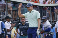 Carlos Ortiz, of Mexico, waves to the crowd before hitting off the first tee during the final round of the Bedminster Invitational LIV Golf tournament in Bedminster, N.J., Sunday, July 31, 2022. (AP Photo/Seth Wenig)