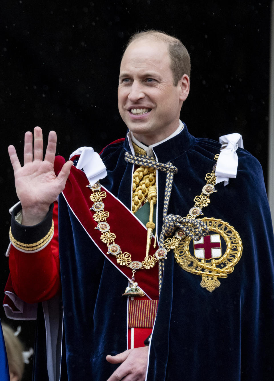 william waving with a balding head